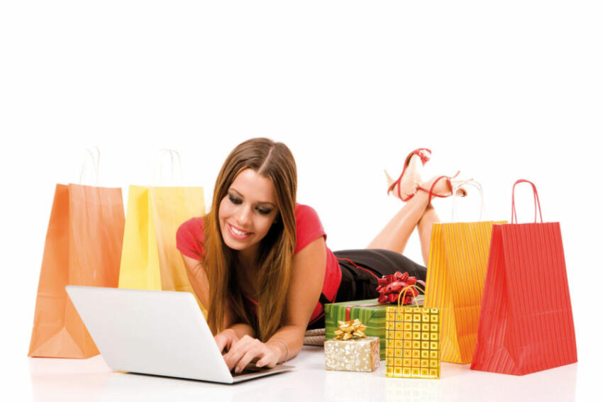 Beautiful young woman shopping over internet