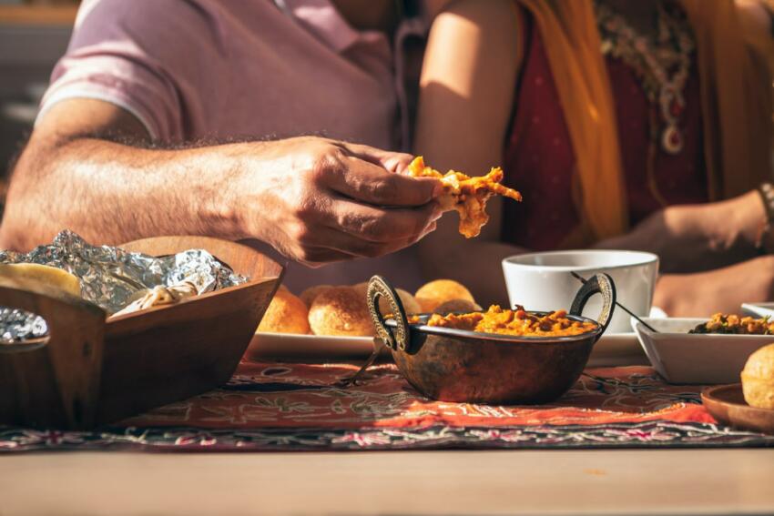 Close up,of,indian,father's,hand,picking,up,indian,food,,which